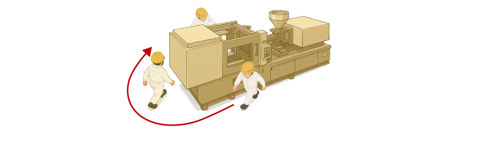Before installation of auto clamps with incomplete clamp detection, an operator checks the clamp lock status on the non-operator side of the injection molding machine.